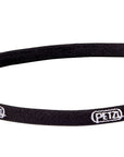 PETZL e+LITE® ultra-compact emergency headlamp in black, showing the elastic headband with integrated whistle and compact design for easy storage and emergency use. (8749904625901)