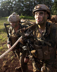 U.S. Marines in camouflage with SPIE rope over their shoulders, fully equipped and waiting for extraction, demonstrating readiness and versatility.  (8745383624941)