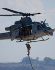 U.S. Marine fast roping from a helicopter using a Ravenox Military Fast Rope, demonstrating safe and efficient descent. (8745128526061)